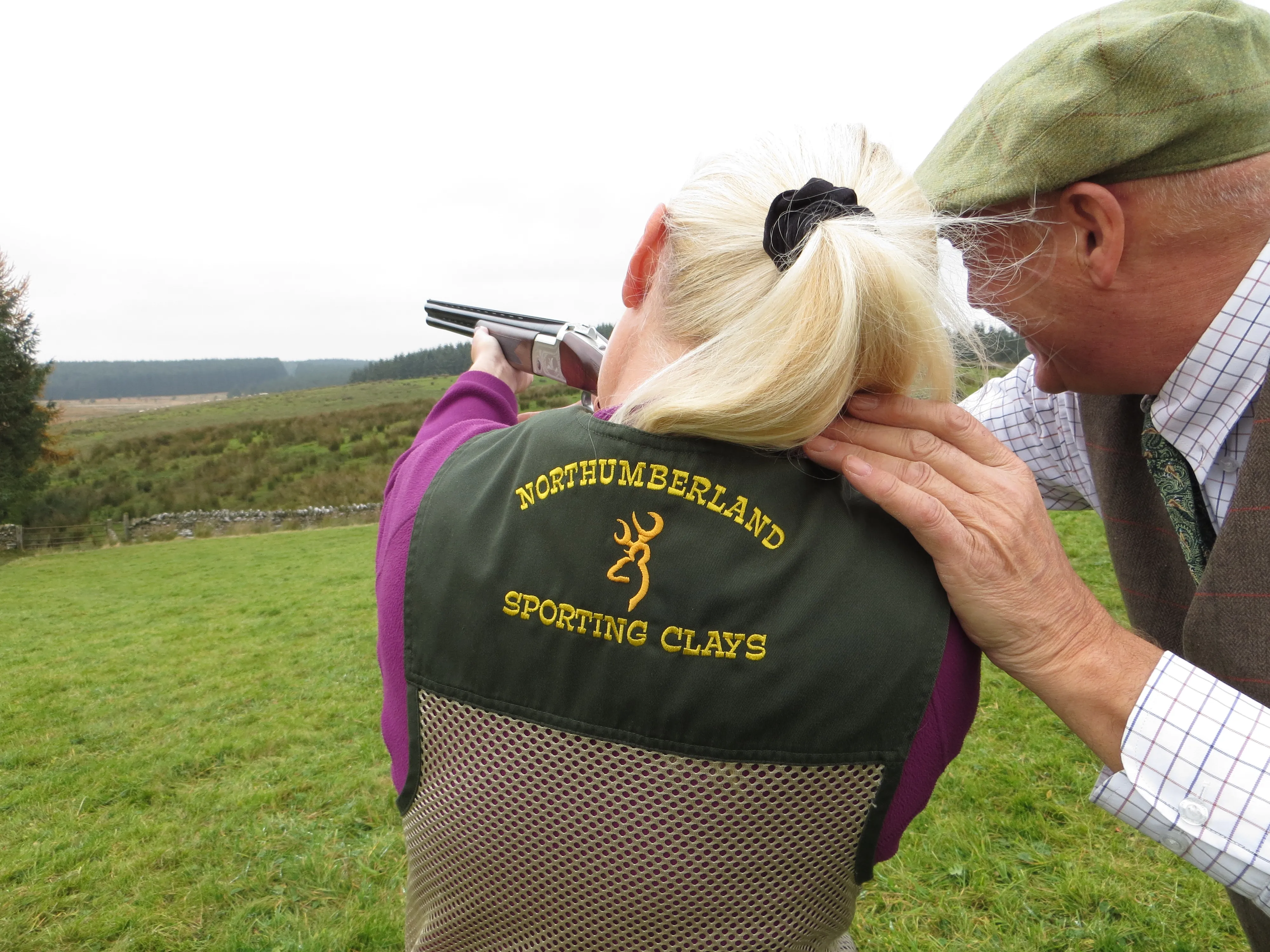 Person receiving a shooting lesson