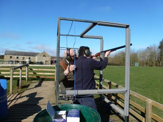 Person receiving a shooting lesson